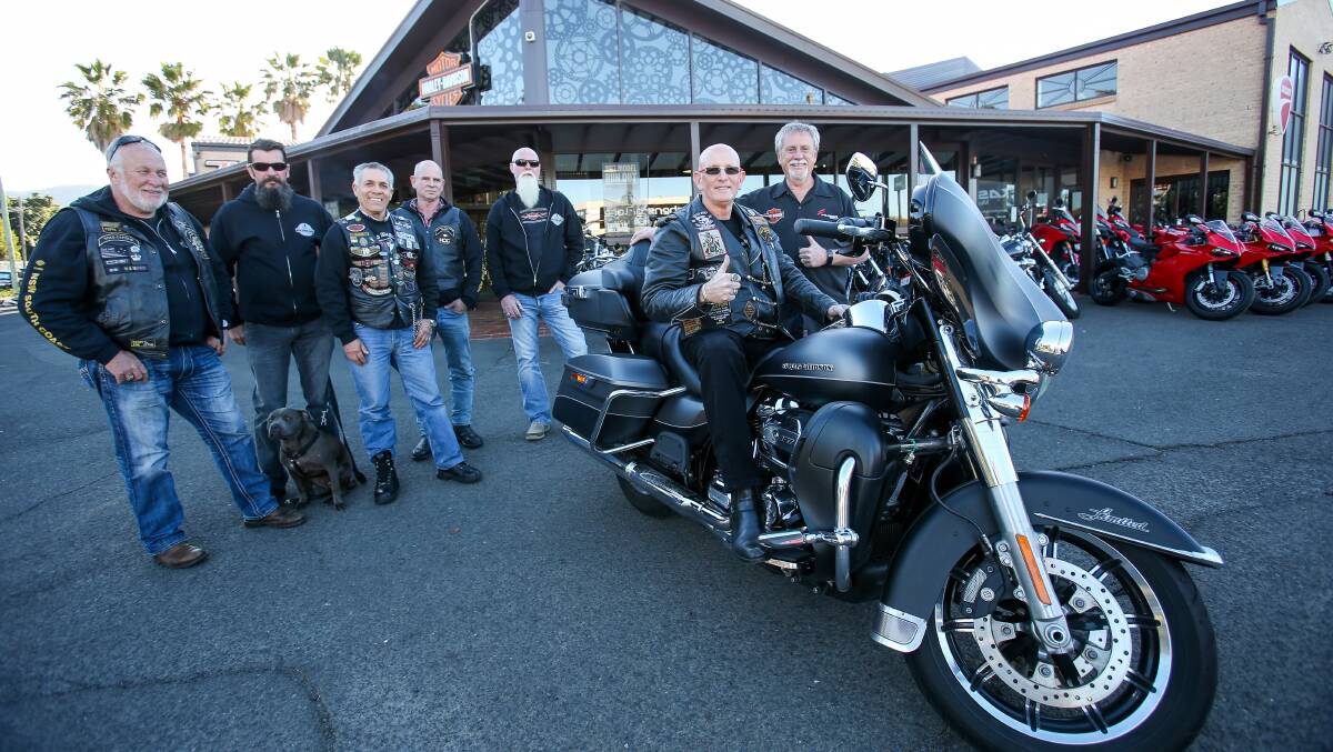 DEMENTIA RIDE: ​Ian Waddell from Frasers Motorcycles in Fairy Meadow welcomes  Greg Kelly, who is riding around Australia for dementia awareness. Picture: Adam McLean