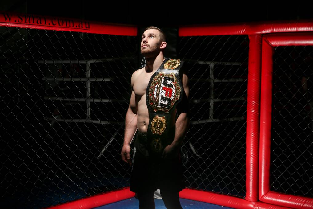 LOOKING UP: Full Circle MMA fighter Adam Bailey has his sights set on higher honours after claiming a maiden Australian title just 15 months after taking up the sport. Picture: Adam McLean