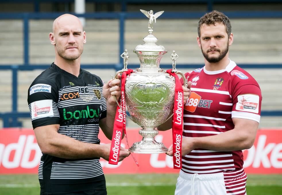 Hull FC captain Gareth Ellis and Wigan Warriors' captain Sean O’Loughlin pose with the trophy ahead of the Challenge Cup Final in Leeds last August. Picture: Danny Lawson/PA Wire Super League