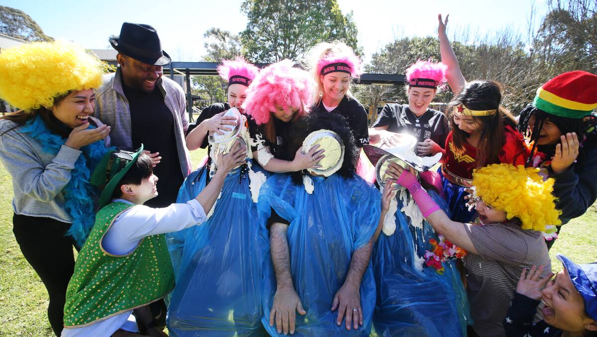 PIE IN THE FACE: TAFE Wollongong students hold a trial Amazing Race Wollongong event, ahead of the main event on September 29. Picture: Sylvia Liber.