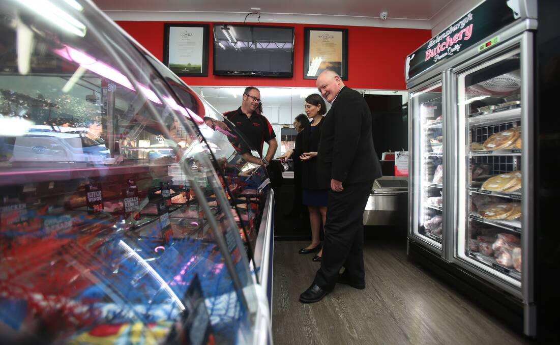 NSW Premier Gladys Berejiklian and Heathcote MP Lee Evans talking with  Helensburgh Butchery's Jason Rooke during a visit to the suburb on Monday morning. Picture: Robert Peet