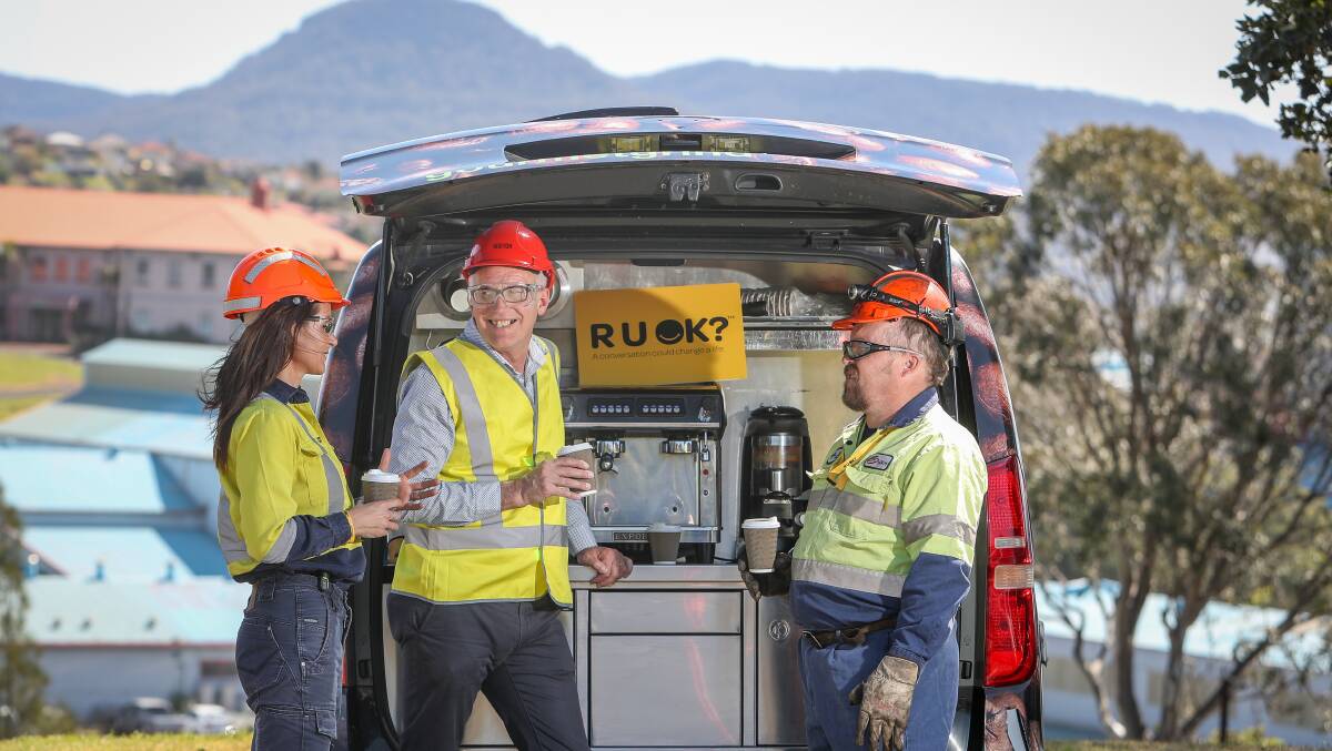 Checking in: Lifeline South Coast executive director Grahame Gould (centre) shares a coffee, and a conversation, with BlueScope employees Liz Mobbs and Troy Smolenaars. Picture: Adam McLean