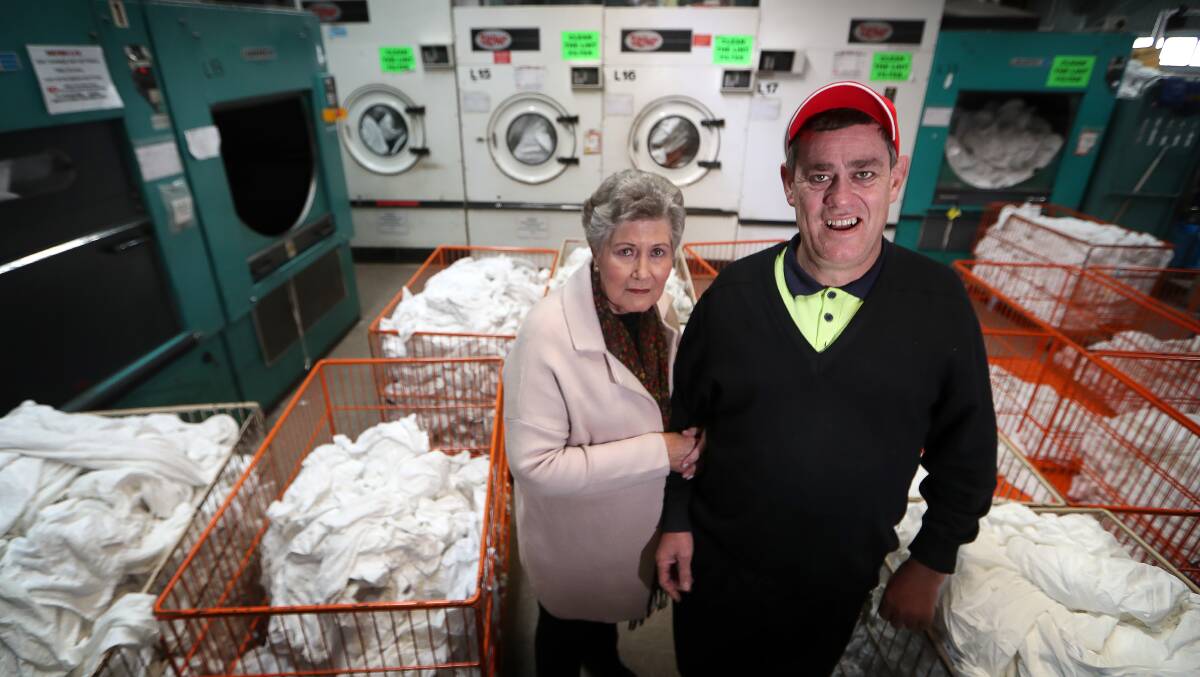 Job satisfaction: Mark May enjoys working for Flagstaff's industrial laundry services but his mother Jan is worried a new wages tool will place financial constraints on his employer and force it to cut jobs. Picture: Sylvia Liber
