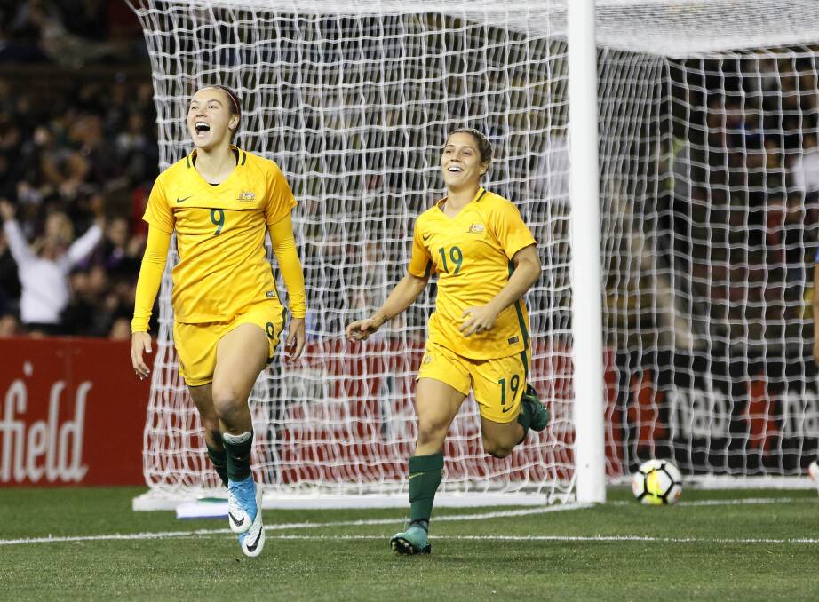 On target: Caitlin Foord (left) celebrates after scoring a goal. Picture: AAP Image/Darren Pateman