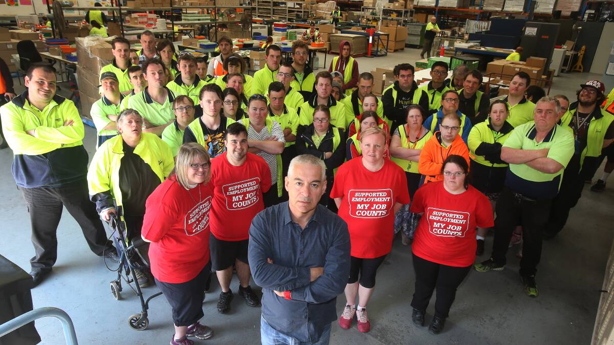 Enterprising: Greenacres CEO Chris Christodoulou, pictured with some of the organisation's supported employees, ahead of a Tuesday rally against wage reform in the sector. Picture: Robert Peet