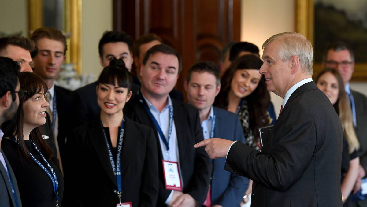 Prince Andrew, the Duke of York (right), speaks to young entrepreneurs. He will be at UOW Innovation Campus on Tuesday, September 26. Picture: AAP Image/Joe Castro.
