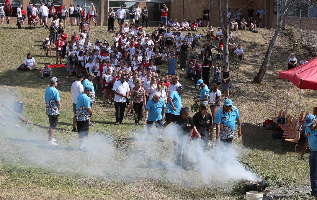 SMOKING CEREMONY: Aboriginal elders conducted a smoking ceremony and the first sods of Albion Park High School's living classroom were turned on Friday. Picture: Robert Peet