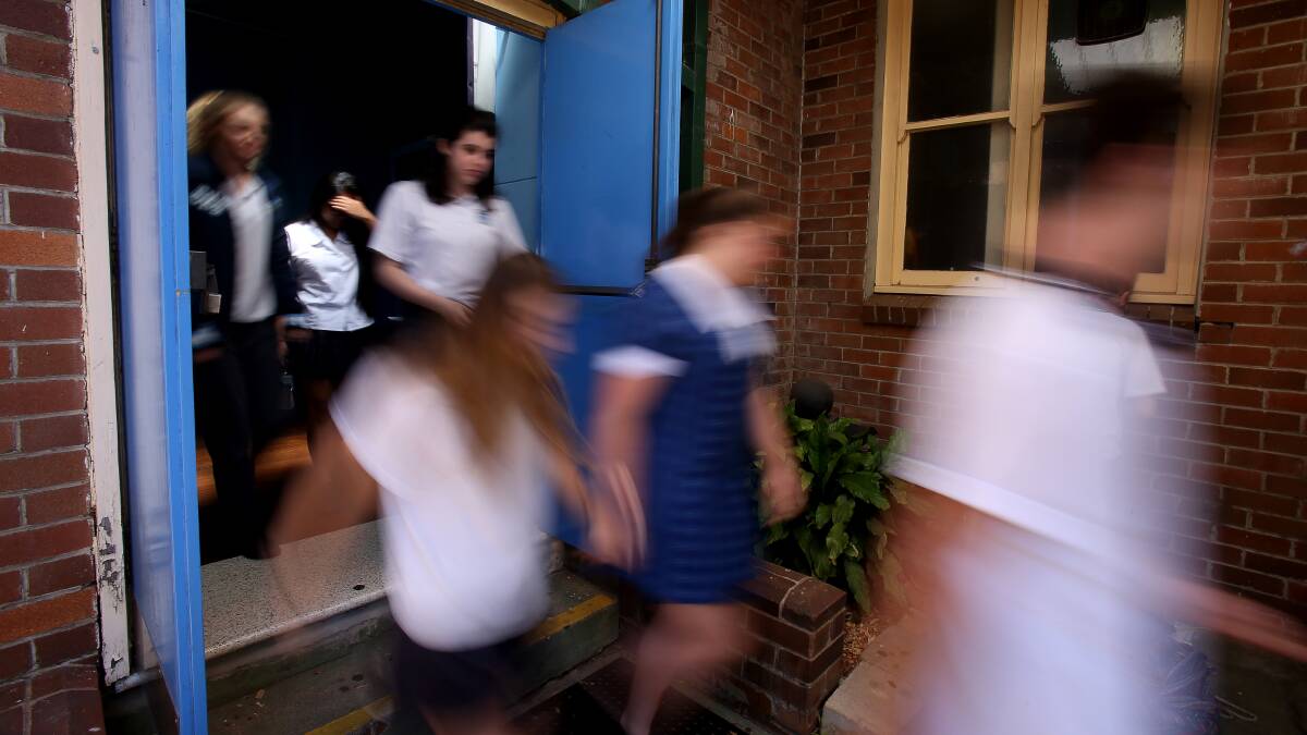 ONE DOWN: Corrimal High School students leaving after finishing their HSC English exam on Monday, October 16. Picture: Robert Peet
