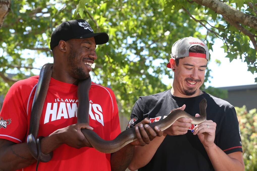 BIG ADDITION: Delvon Johnson meets Olly the python. Picture: Robert Peet
