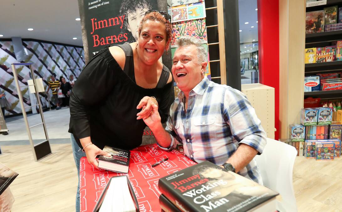 Fan Toni Utatao meeting Jimmy Barnes at a book signing for fans for his sequel memoir Working Class Man at Dymocks Wollongong on October 24. Picture: Adam McLean