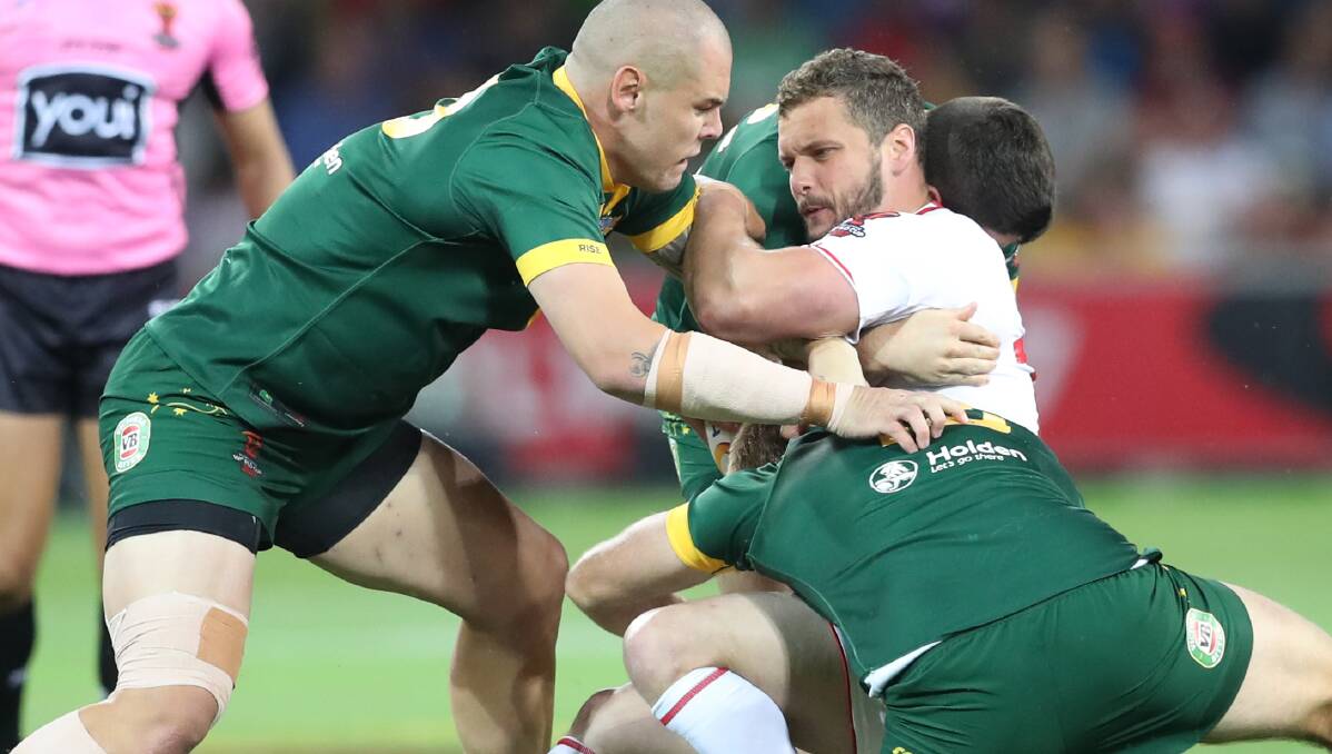 Crunch: England's Sean O'Loughlin is tackled in the loss to Australia in Melbourne. Picture: AAP Image/David Crosling
