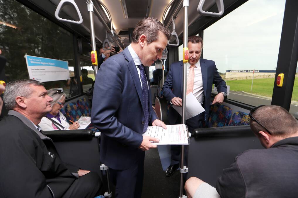 waiting: Illawarra Labor MPs Ryan Park and Paul Scully talk to Gong Shuttle commuters. The pair are concerned about the delay in a new funding deal. 