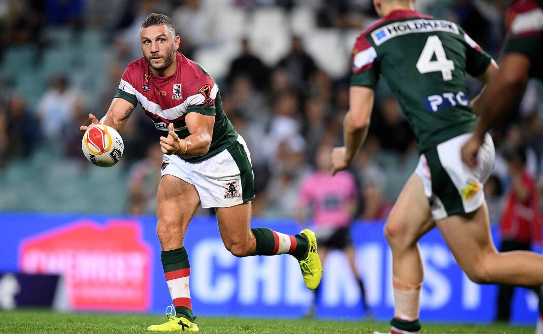 Bite me: Robbie Farah of Lebanon passes the ball against England. Picture: AAP Image/Dan Himbrechts
