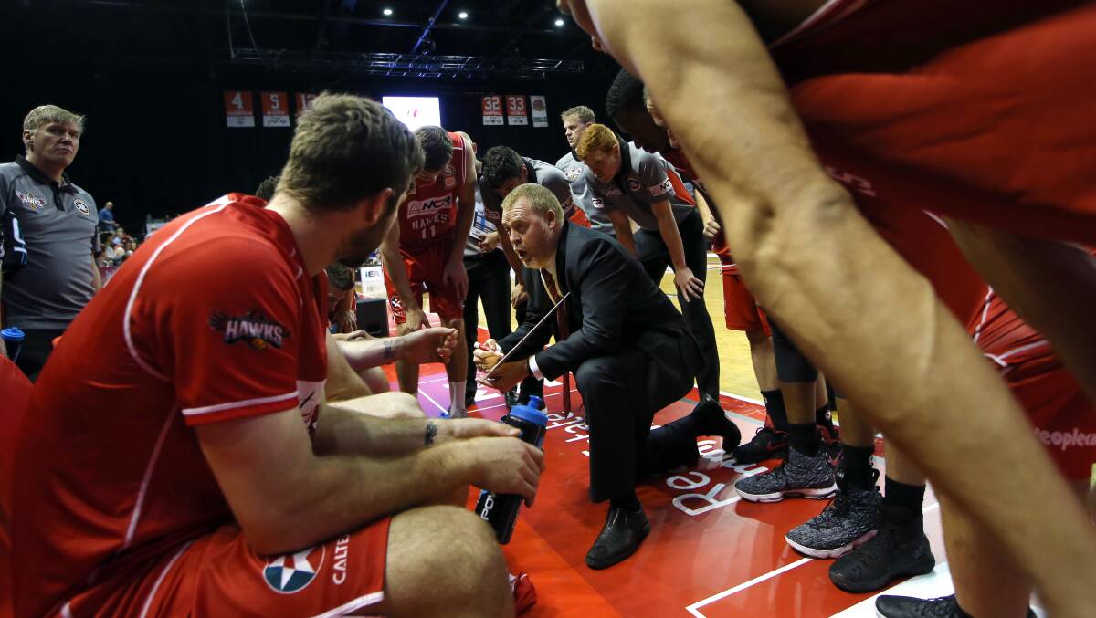 READY AND WAITING: Hawks coach Rob Beveridge relays instructions to his troops in their win over Sydney Kings. Picture: SYLVIA LIBER