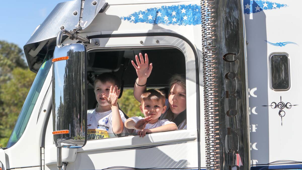 FAMILY AFFAIR: Driving on a truck during the Illawarra Convoy was a blast for young and old alike. Organisers expect to raise over $1.3 million. Picture:Adam McLean