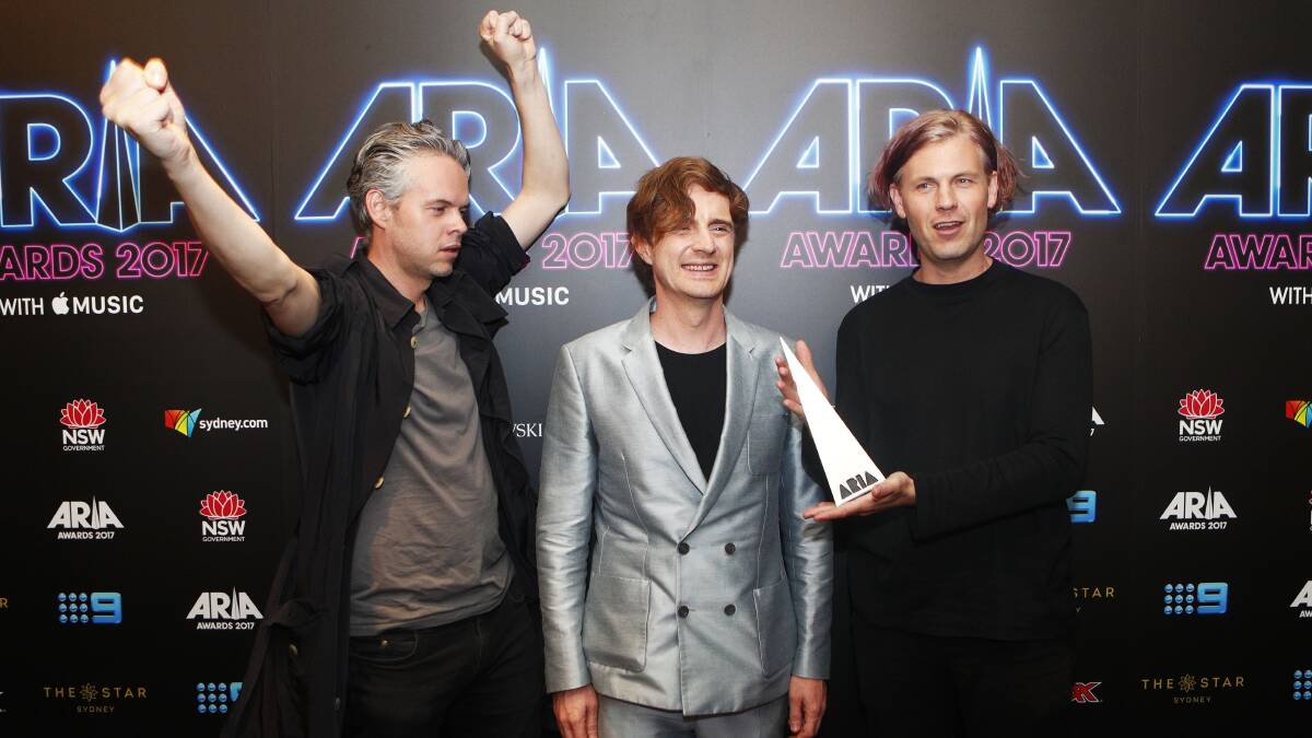 Nick Littlemore, Sam Littlemore and Peter Mayes from PNAU pose with the ARIA award for Best Dance Release at the 31st ARIA Awards at in Sydney on November 28. Picture: AAP Image/Daniel Munoz