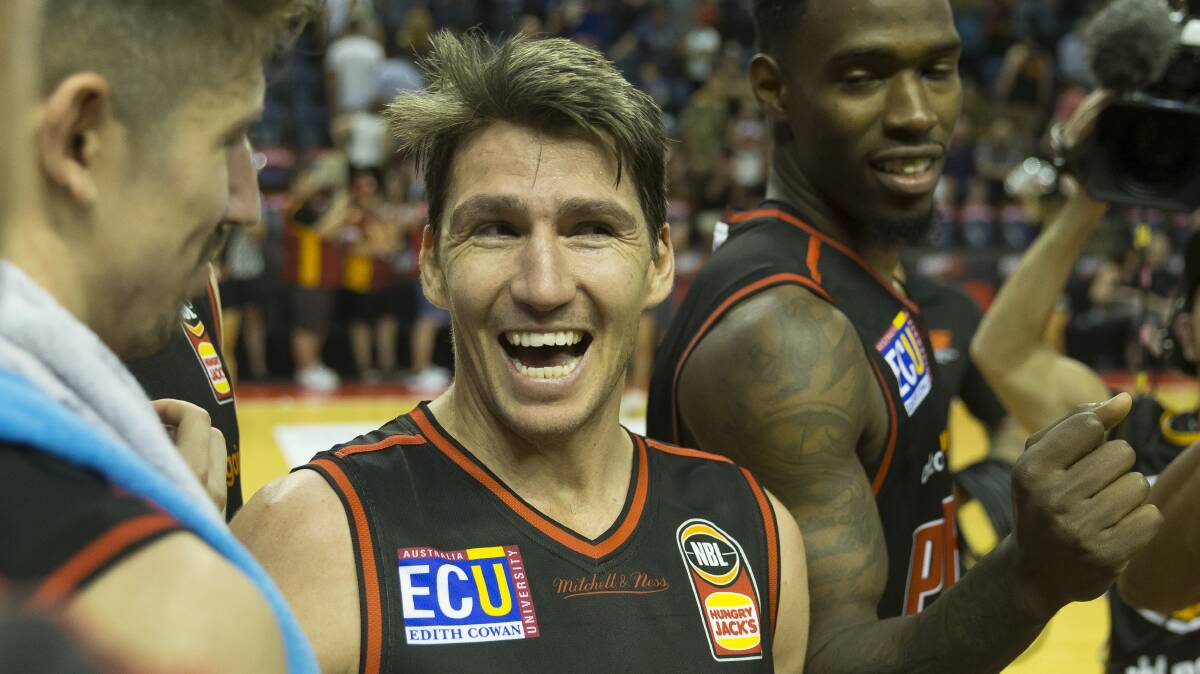 ON THE RIGHT TRACK: Perth Wildcats skipper Damian Martin celebrates at full time after they beat the Illawarra Hawks at WIN Entertainment Centre. Picture: AAP