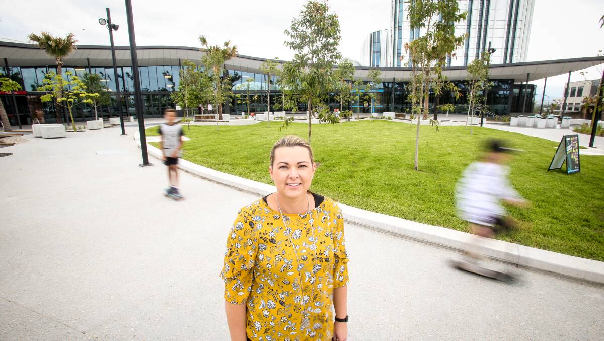 Shellharbour Council acting general manager Melissa Boxall in the plaza filled with trees and public art. Picture: Georgia Matts 