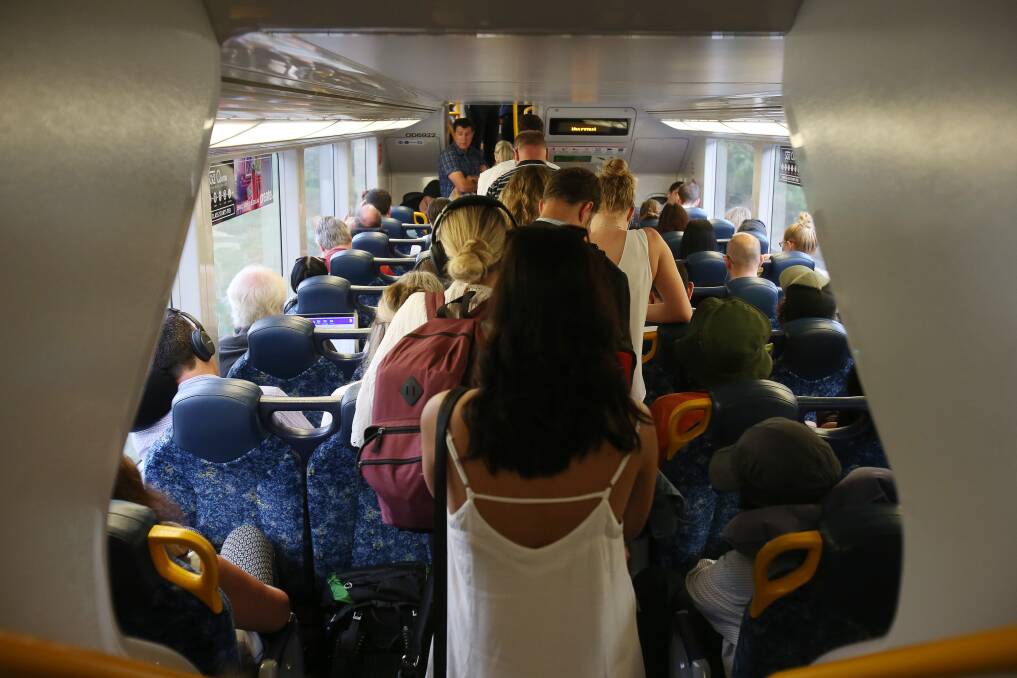 Stand up: By the time the 6.4am train left North Wollongong bound for Sydney, there were no seats left. Pictures: Robert Peet