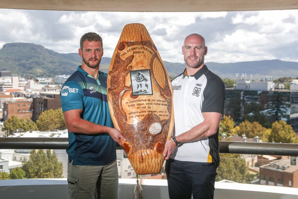 Wigan Warrior Sean O'Loughlin and Hull FC's Gareth Ellis with the Kenny-Sterling Shield made by artist Uncle Noel Butler for the Super League game at WIN stadium. Picture: Adam McLean