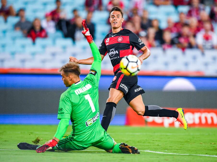 STAR POWER: Chris Ikonomidis scores for the Wanderers against the Phoenix last Saturday night. Picture: AAP Image/Brendan Esposito
