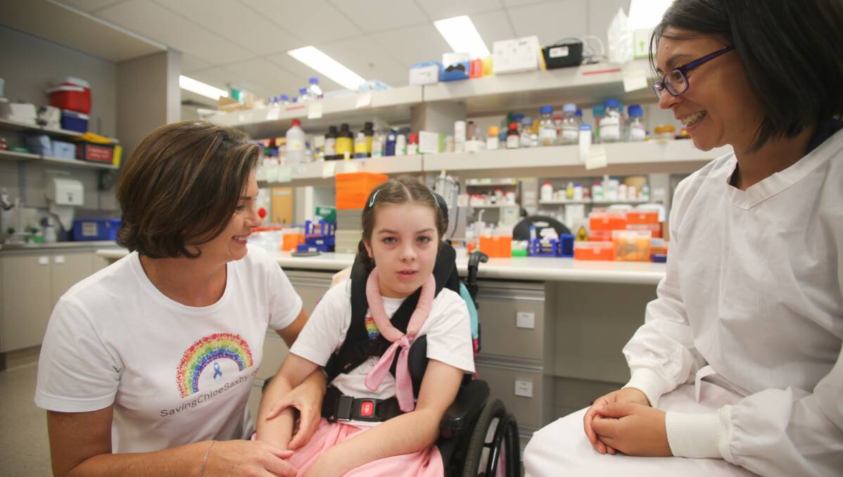 Australian first: Woonona girl Chloe Saxby and her mother Nyree discuss a new research project into Chloe's rare disease with Illawarra Health and Medical Research Institute neuroscientist Dr Lezanne Ooi. Picture: Georgia Matts 