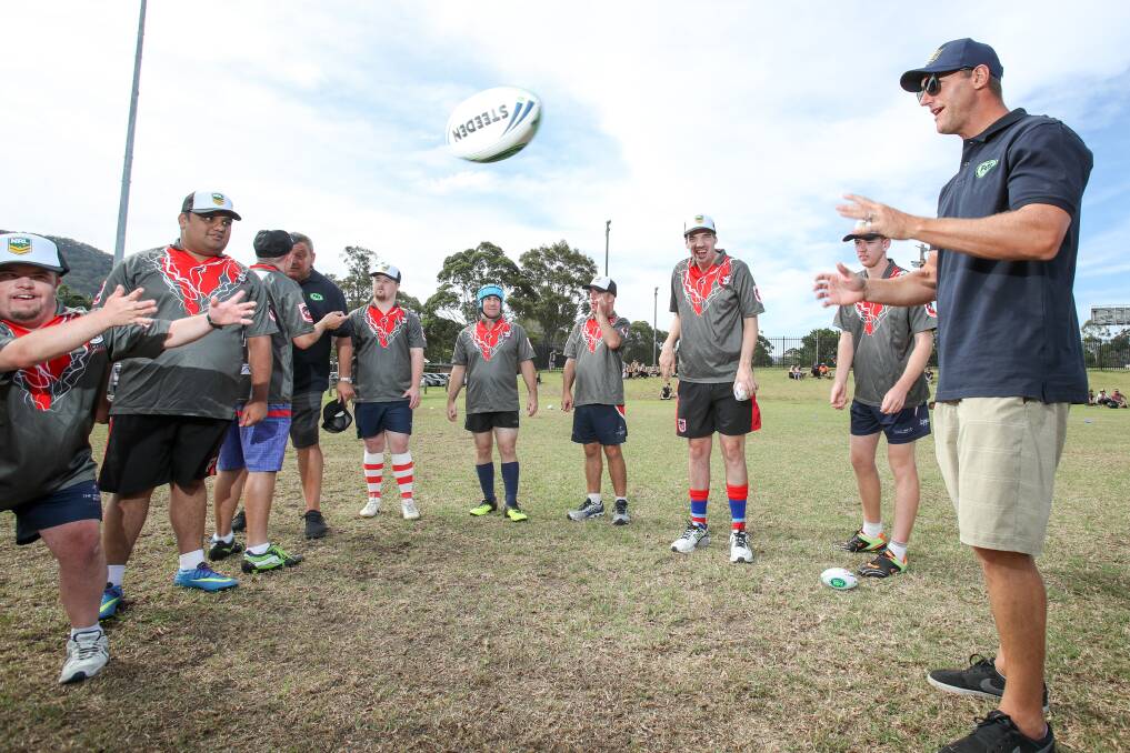 GIVING BACK: Mark Gasnier conducted a coaching clinic for members of the SCORE Dragons team at Corrimal this week as part of of Fox League's Full-On Footy tour. Picture: Adam McLean 