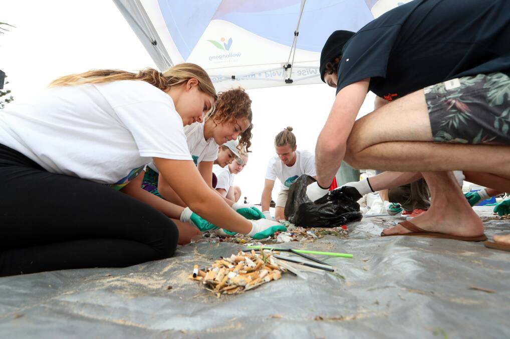 BEAT THE BOTTLE: Volunteers sorting through rubbish. Picture: Sylvia Liber