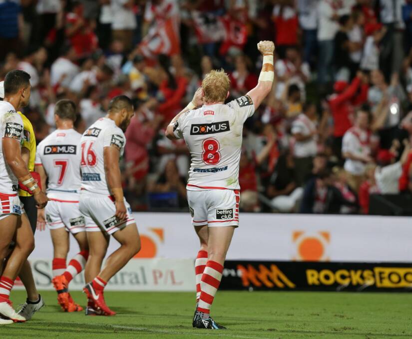 JUBILANT: Dragons players celebrate with red v faithful. Picture John Veage