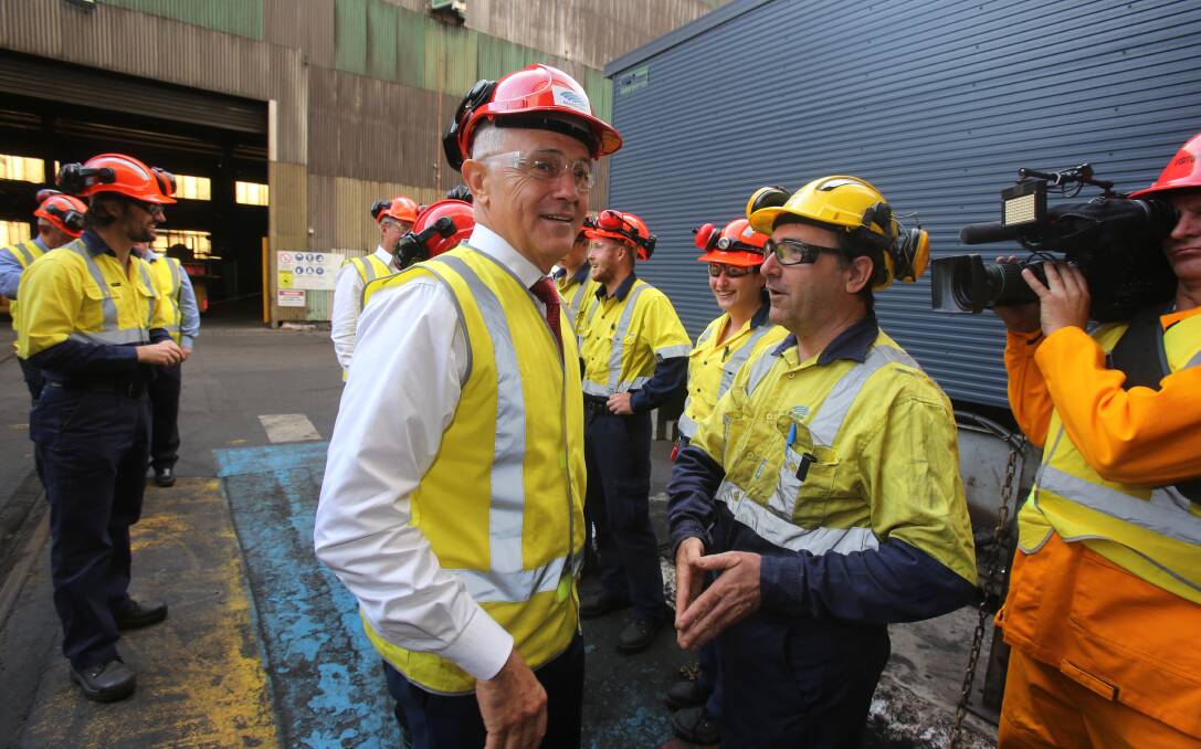 regional reckoning: Prime Minister Malcolm Turnbull chats with steelworkers at Port Kembla. In media comments, Mr Turnbull indicated he viewed the Illawarra as a regional area. Picture: Robert Peet