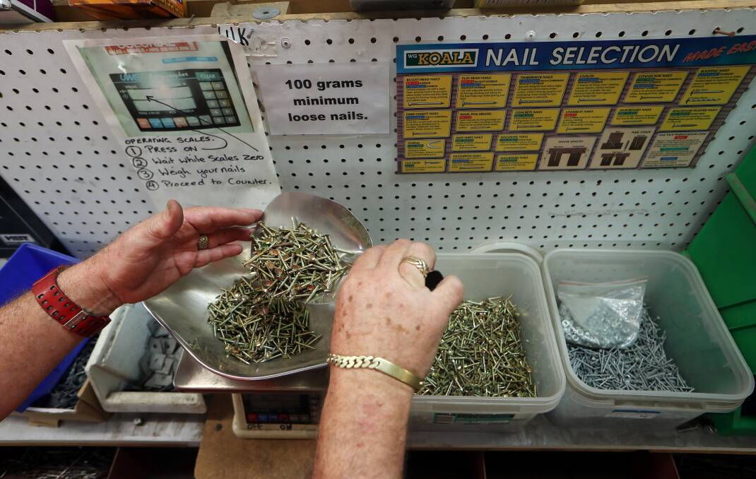DO NOT ADJUST YOUR SET: This is a man measuring out loose nails at a hardware store. Yes, people actually do that. Picture: SYLVIA LIBER.