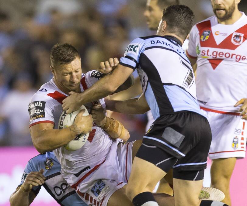 ROUGHING IT: Tariq Sims doing the hard yards in the Dragons' gritty win over Cronulla last week. Picture: AAP Image