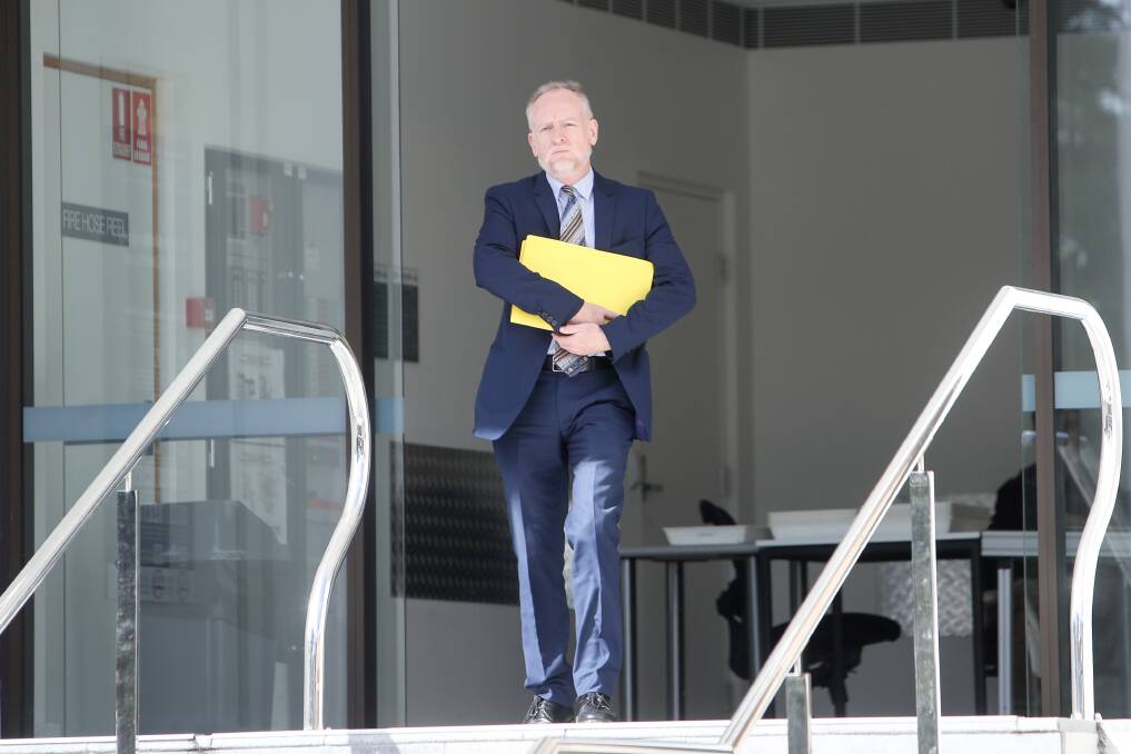 In court: Warilla solicitor Neil McCarthy leaves Wollongong courthouse after entering guilty pleas to two charges on behalf of his client, St Marys Star of the Sea teacher Sarah Heathcote. Picture: Adam McLean
