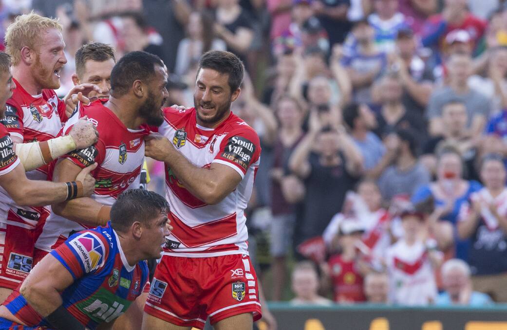 LOOKING GOOD: Leeson Ah Mau is mobbed by teammates after scoring against Newcastle. Picture: AAP