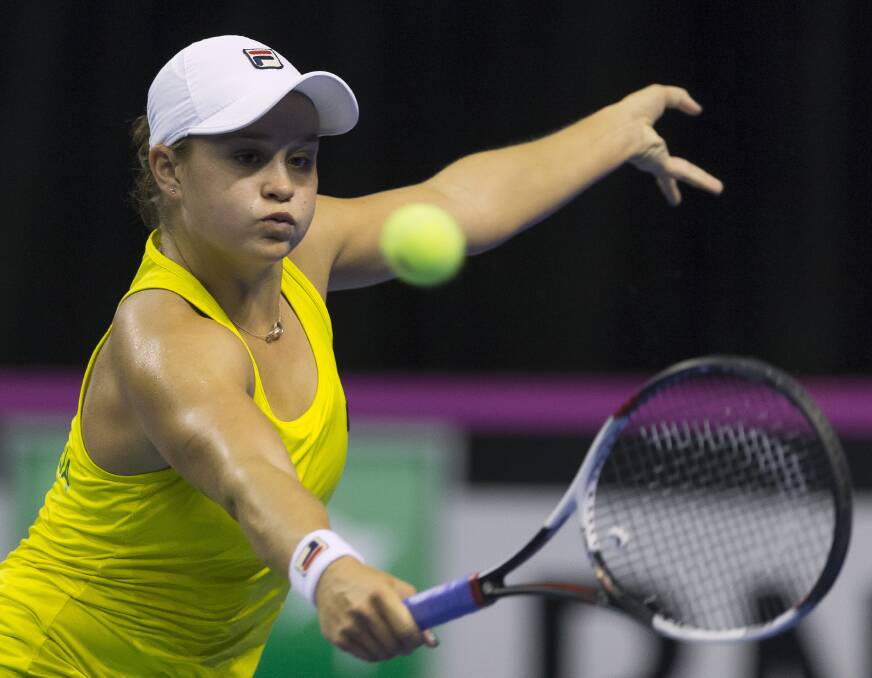 Reach: Ash Barty led Australia's cause at the Fed Cup at WIN Entertainment Centre on Sunday. Picture: AAP Image/Craig Golding