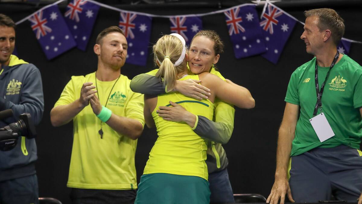 Success: Australian Daria Gavrilova and Sam Stosur embrace on the way to Fed Cup victory on Sunday. Pictures: Adam McLean