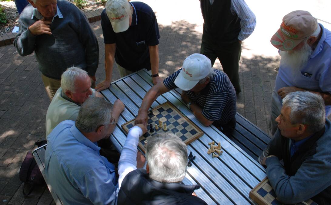 All hands on deck: The chess board is a noisy scene in Globe Lane, with onlookers not shy about yelling their suggestions. Picture: Ben Langford