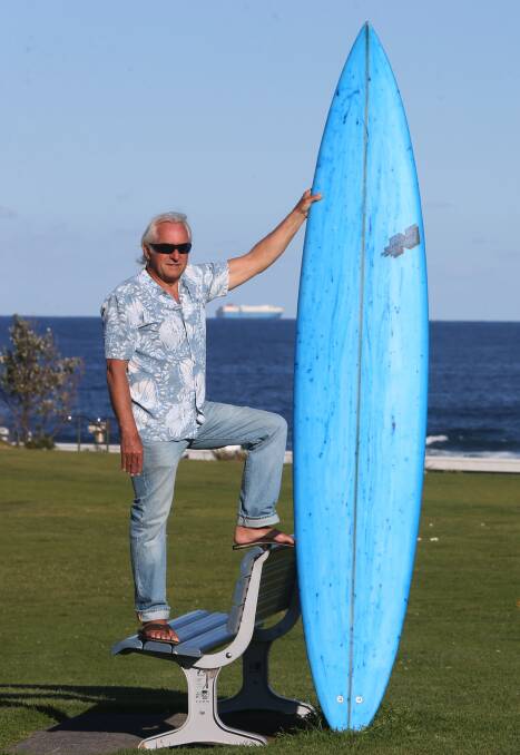 Beat the blues: Paul Nichol at Sandon Point with the blue 'Hawaiian Gun' he shaped to raise money and awareness about depression. Picture: Robert Peet