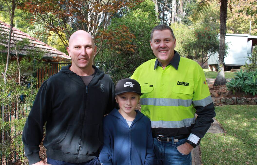 TOP BRASS: Metropolitan mine fire officer Luke Pearson (left) with his son Brock, and Peabody's Australia president George Schuller.