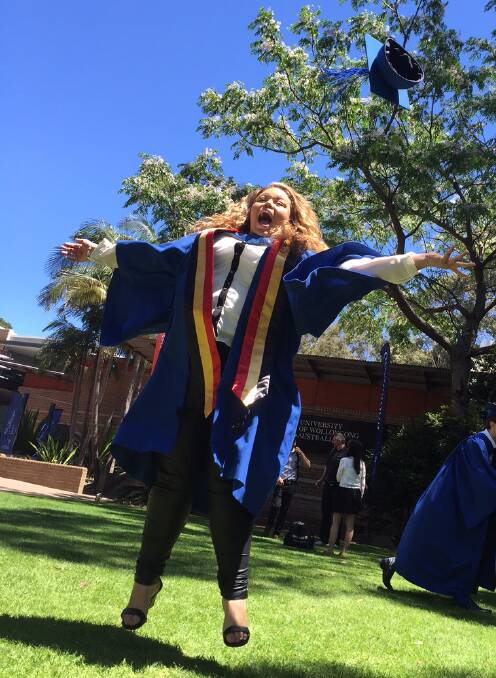 Keep it real: Tamika Briggs jumping for joy at UOW's graduations
