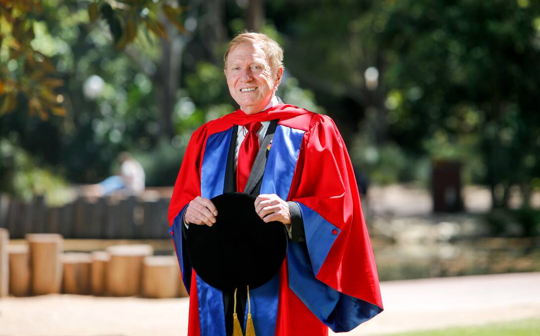 Dream big: Former High Court judge Michael Kirby received the rock star treatment at UOW graduations yesterday. Picture: Adam McLean