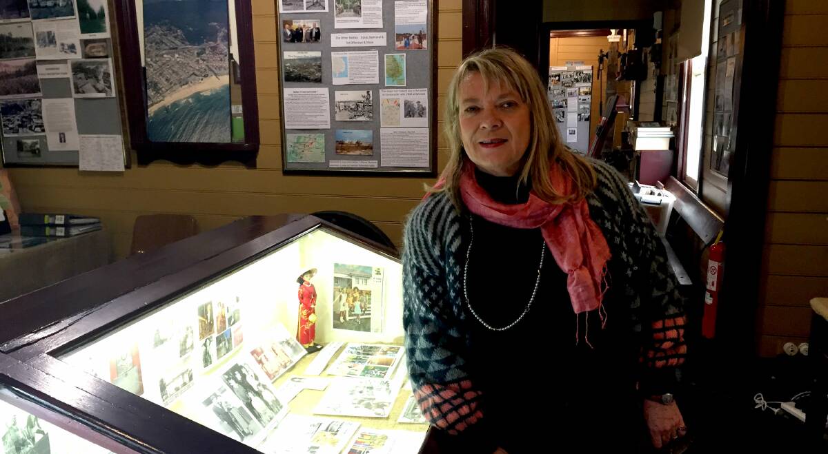 Now and then: Curator Kerrie Anne Christian with some of the displays in the Illawarra in the Vietnam Years exhibition which is now up in Bulli. Picture: Ben Langford
