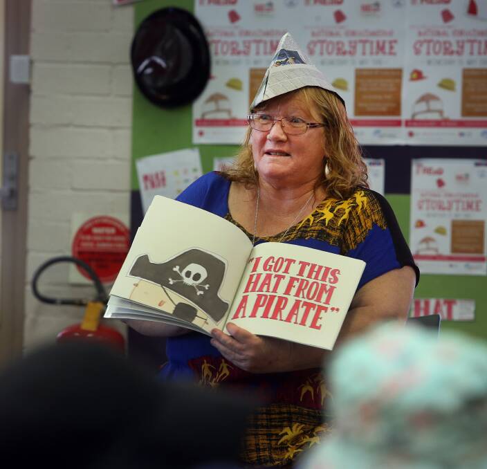 The very scary Baird: Shellharbour Mayor Marianne Saliba reads the book 'I got this hat' to children at Warilla library for National Simultaneous Storytime on Wednesday. Picture: Robert Peet.