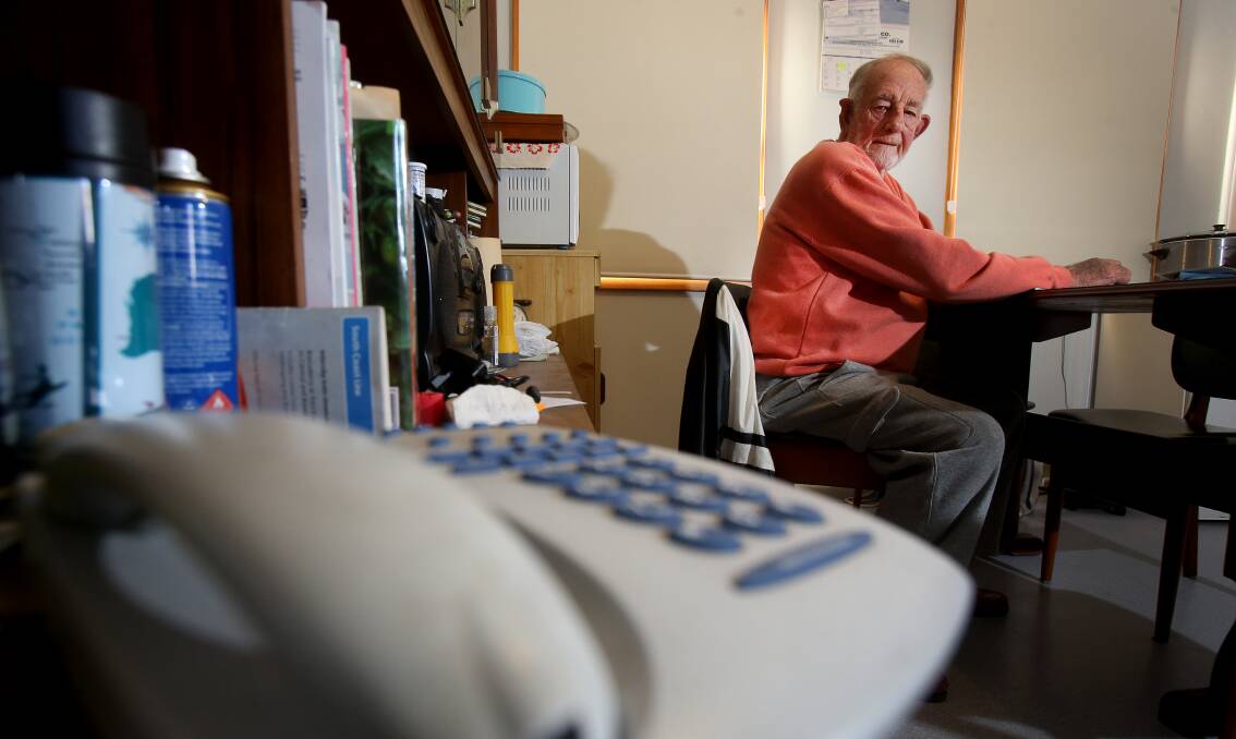 Gone dead: Towradgi pensioner Peter Grew has had enough of his phone connection troubles and wants a better explanation from Telstra. Picture: Robert Peet