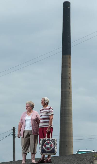 Powerhouse: Helen Hamilton and Olive Rodwell on Reservoir St shortly before the copper smelter stack came down. Picture: Adam McLean