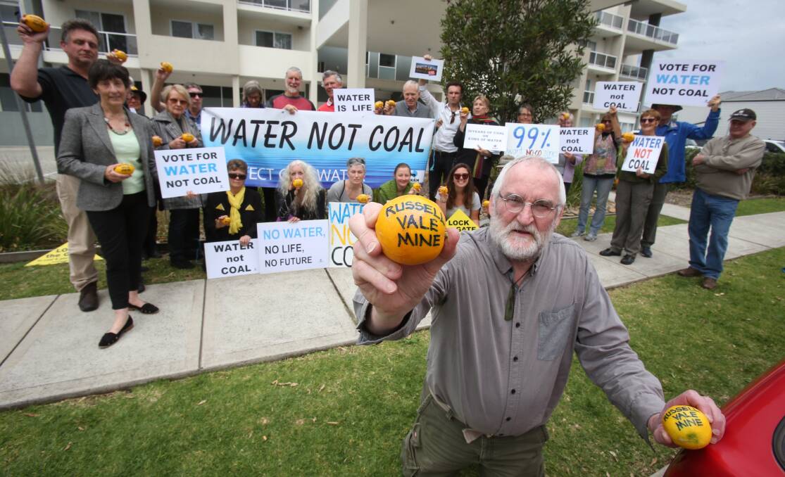 Lemons: Illawarra resident Gavin Workman and protesters make their point outside, saying the Russell Vale mine carries too much risk to the water catchment