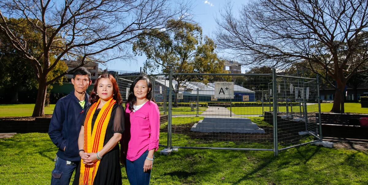 Commemoration: Phong Le, Teresa Tran and Viet Do at the MacCabe Park site of the memorial to fallen South Vietnamese. Ms Tran thanked the Vietnam Veterans' Association for their support. Picture: Adam McLean