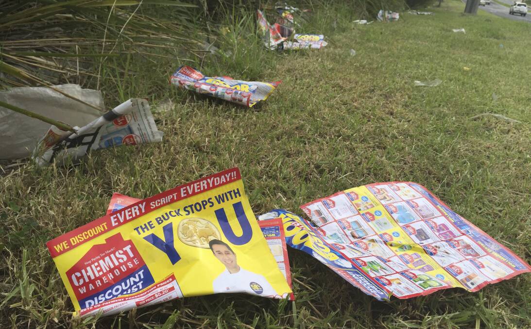Buck stops with who?: Glossy ads for Chemist Warehouse litter Wollongong's Springhill Rd, raising the ire of Lord Mayor Gordon Bradbery on Thursday. Picture: Ben Langford