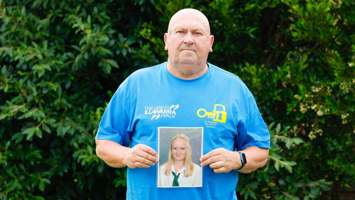 Ray McCrimmon, owner of Great Illawarra Walk sponsor Illawarra Security Guards, with a photo of his late daughter Jaimee. Picture by Anna Warr