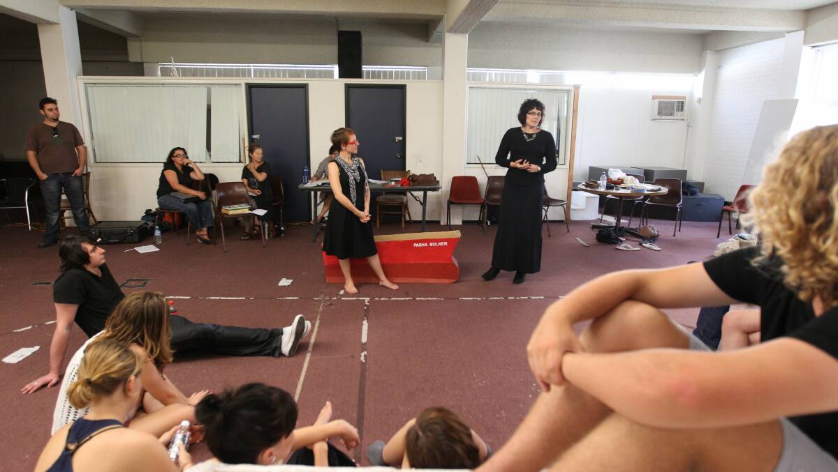 CAPTURING A CITY: Alana Valentine (standing right) with a Tantrum Theatre cast during rehearsals of her Newcastle-set play, Grounded, in 2012. Picture: Ryan Osland